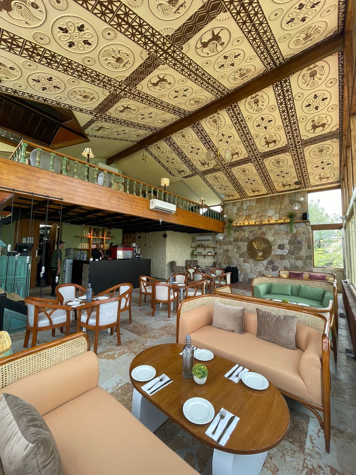 Narcoz cafe interior with ornate ceiling and mezzanine